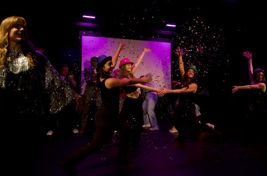 Four dancers pose under a cloud of confetti at The Nova Show.