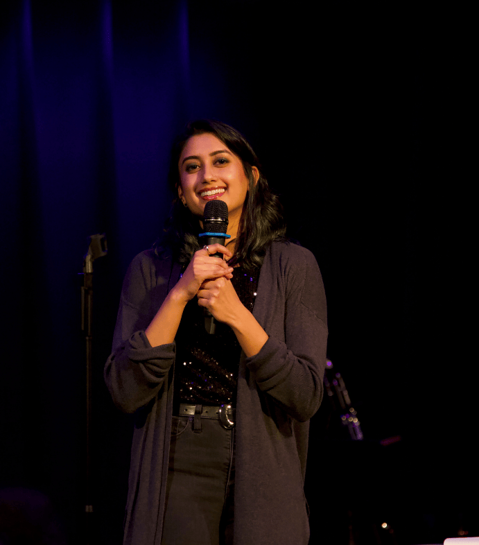 Shruti Datari speaks into a microphone at The Nova Show